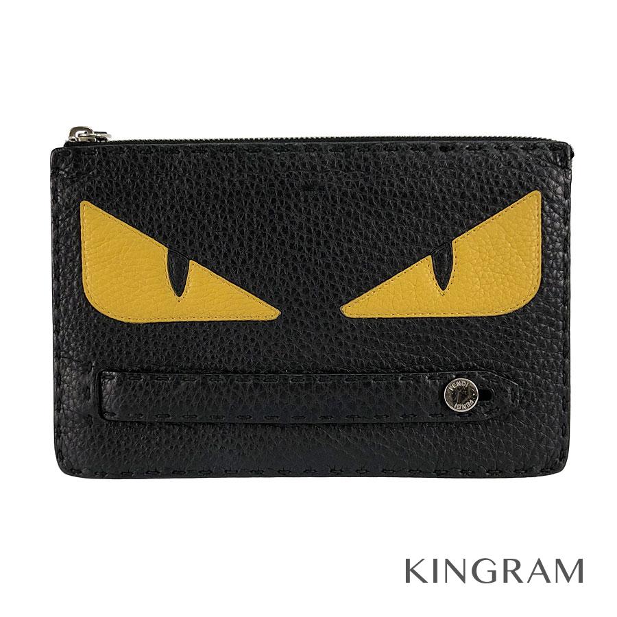 black and yellow clutch bag