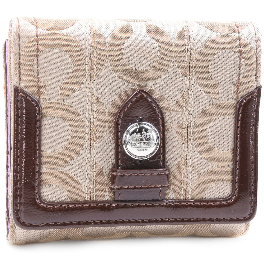 coach bifold wallet in signature canvas